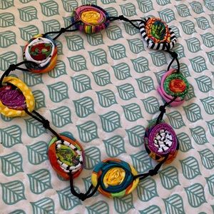 Multi colored coiled fabric necklace